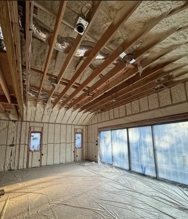 Interior walls and ceiling insulated with spray foam during new construction in Newnan